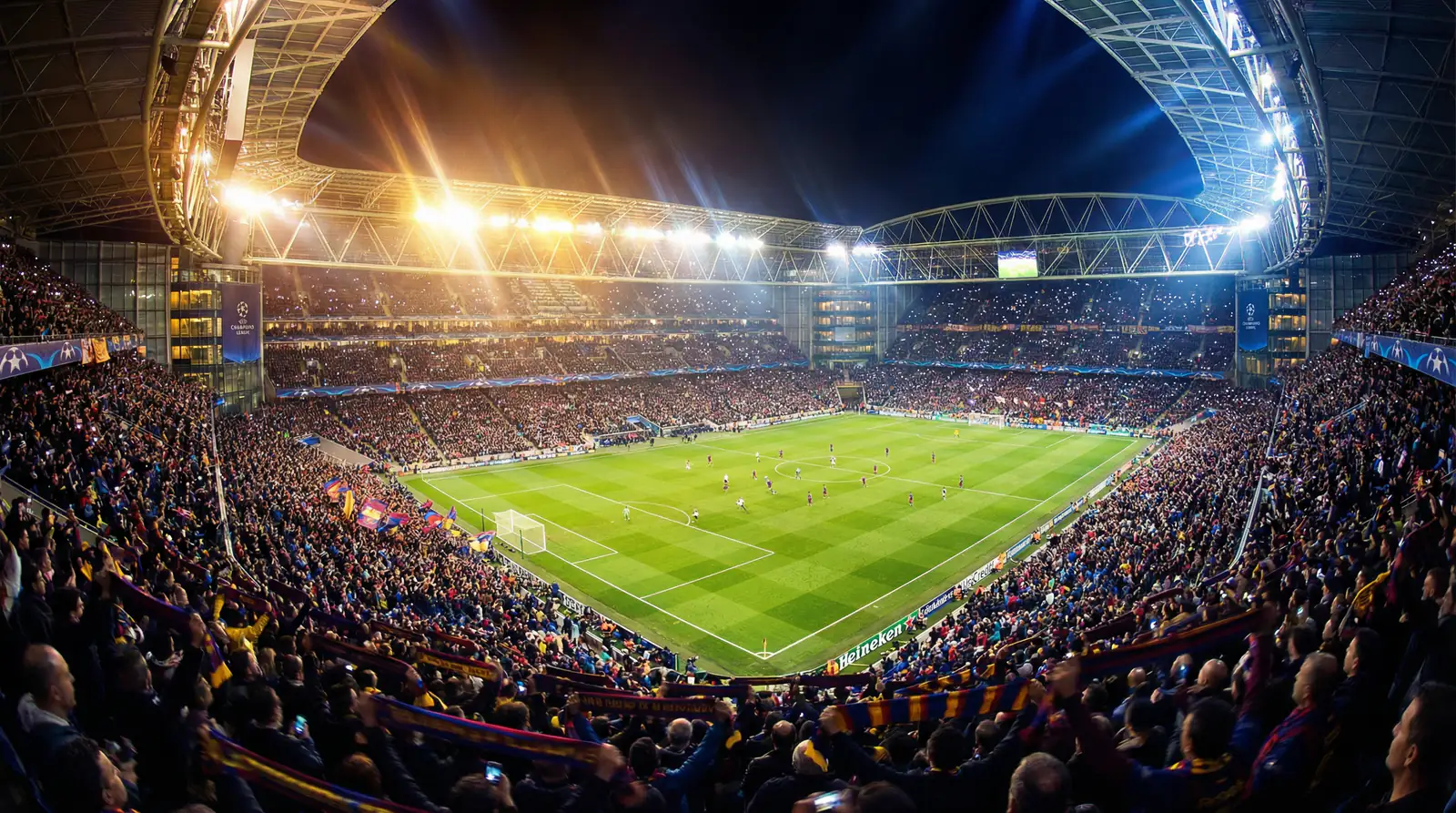 Stade de football européen illuminé lors d'une soirée de Ligue des Champions avec des supporters passionnés dans les tribunes